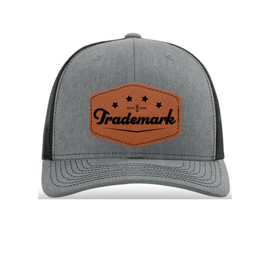 Trademark - Engraved Leatherette Patch Trucker Hat